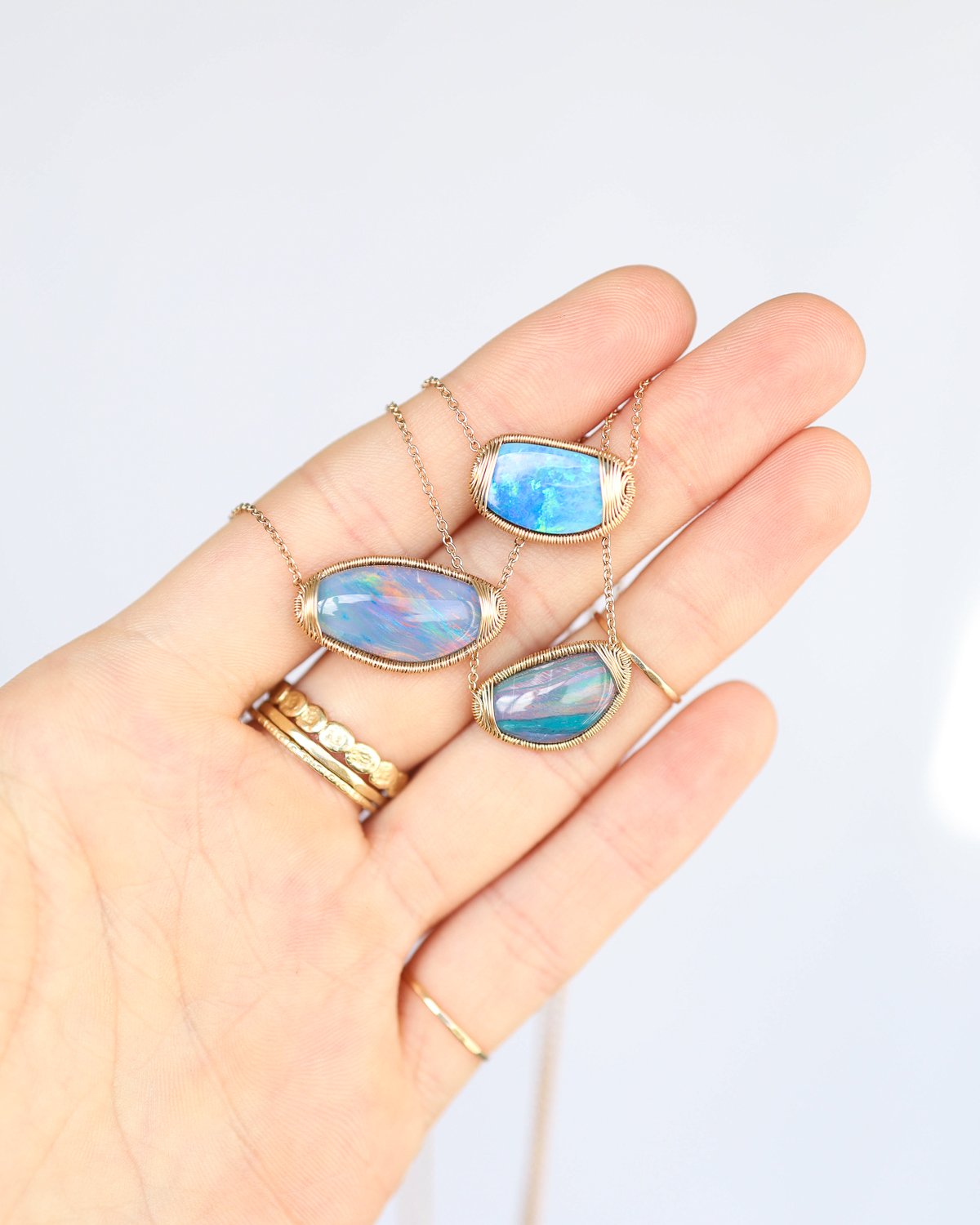 Gold wire wrapped opal necklaces by jewelry designer Dana Kellin