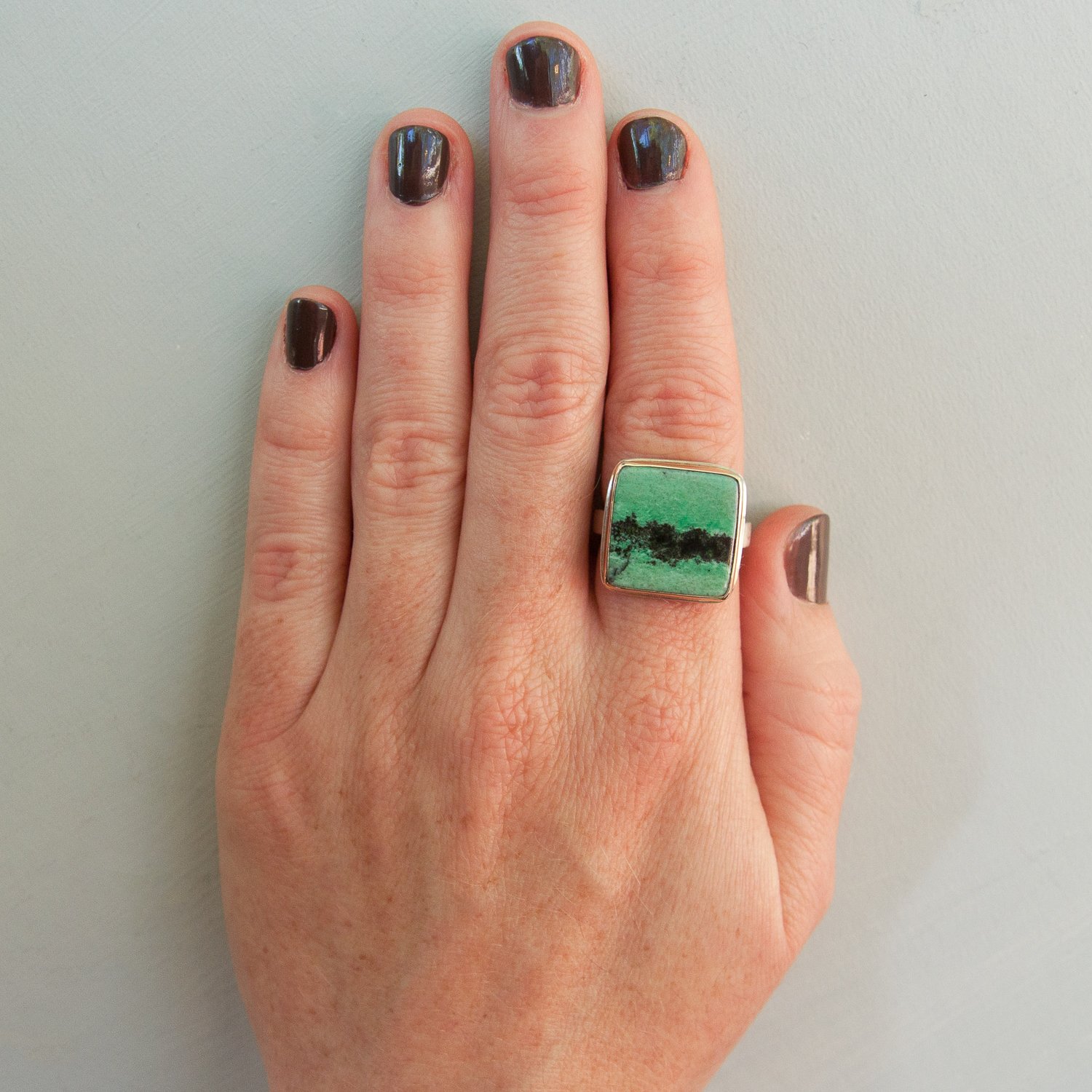 Jamie Joseph: SS & 14k Gold Ring w/ Square Smooth Grossular Garnet on X band