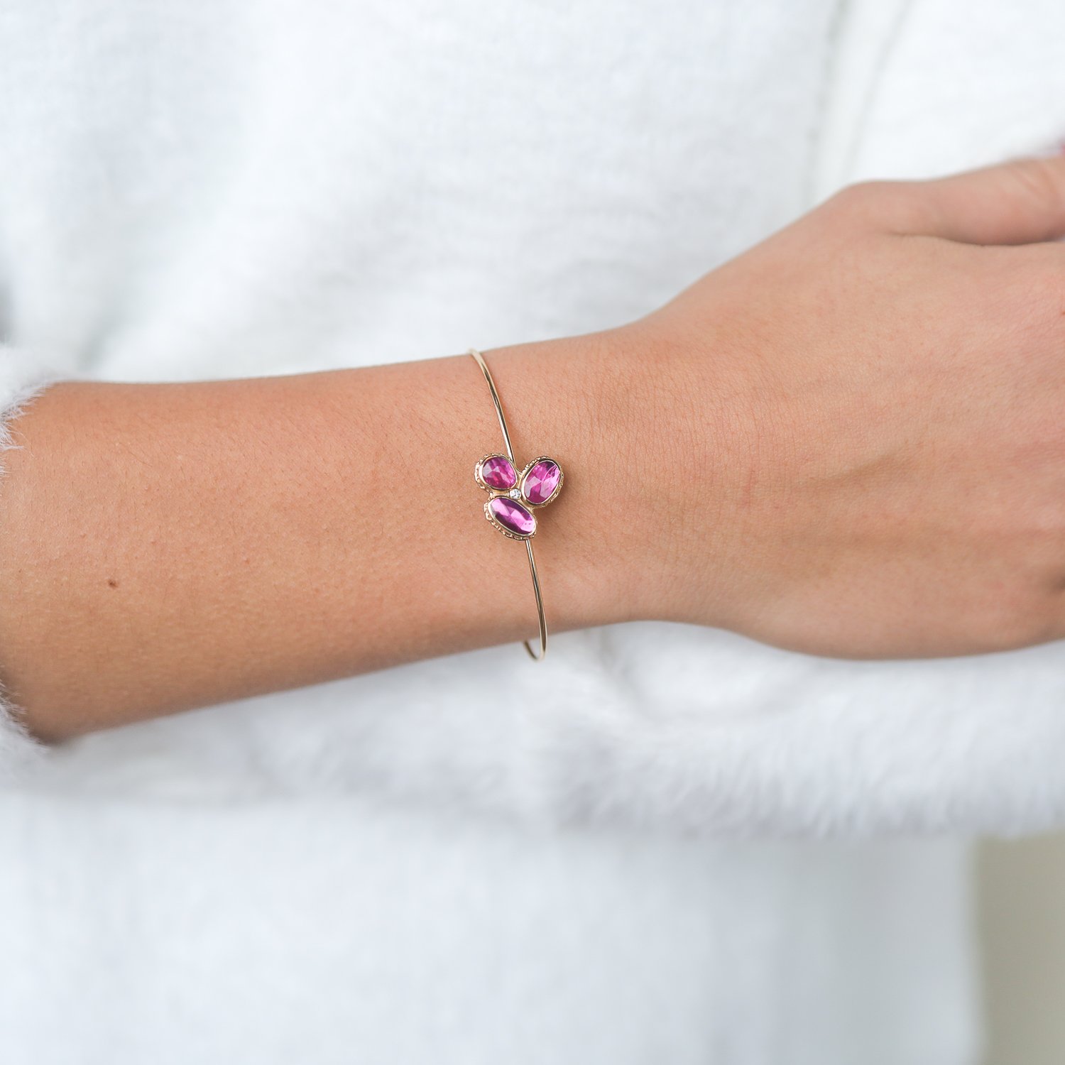 Jamie Joseph:14k Gold bracelet w/triple asymmetrical rose cut mozambique ruby cluster on ruffeled platform w/ .025ct diamond