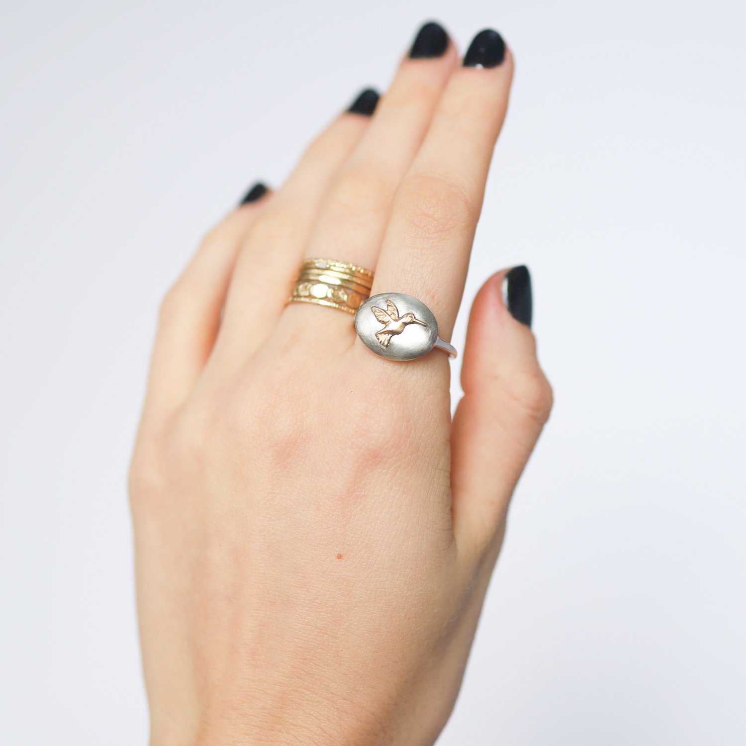 Jamie Joseph: Ring,Sterling silver & 14k Gold ,Hummingbird on small oval open back platform ,Stone measures 1/2 x 5/8