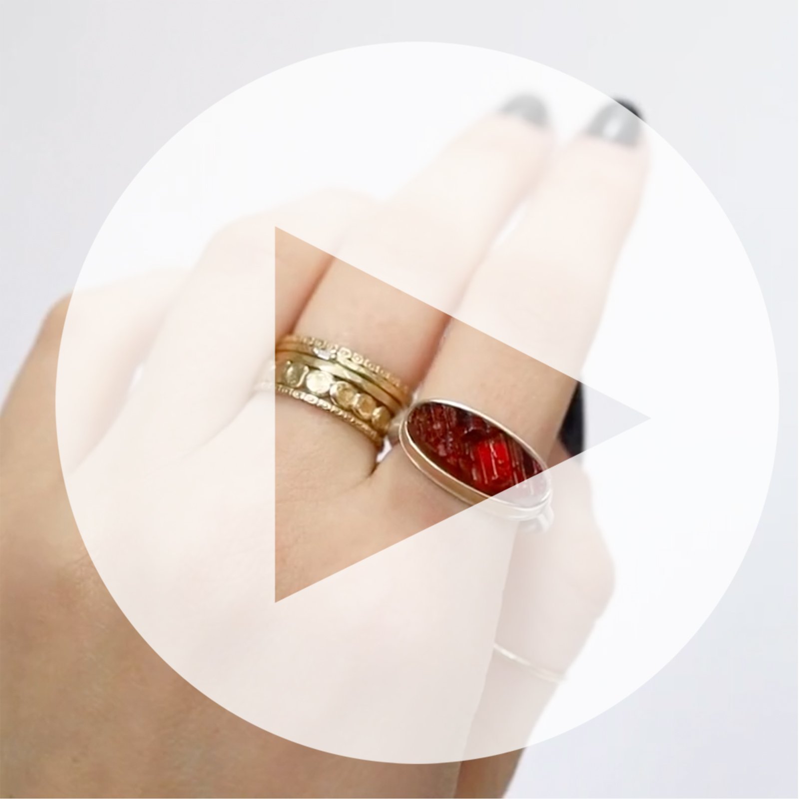 Jamie Joseph: Ring, Small surface cut oval, 14K yellow gold bezel set garnet, Sterling silver Egyptian band, Stone measures 1/4 x 11/16, Currently available in size 7