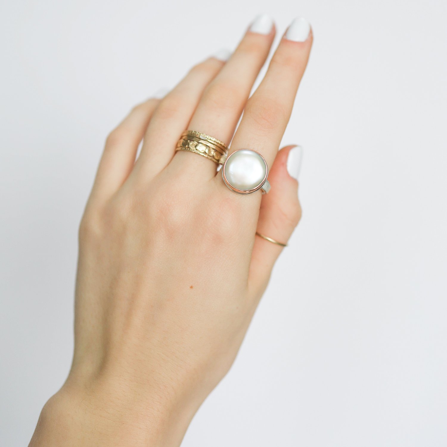 Jamie Joseph: Ring, Round, 14K rose gold bezel set cultured pearl, Sterling silver soft live edge band, Stone measures 9/16 in diameter, Currently available in size 7