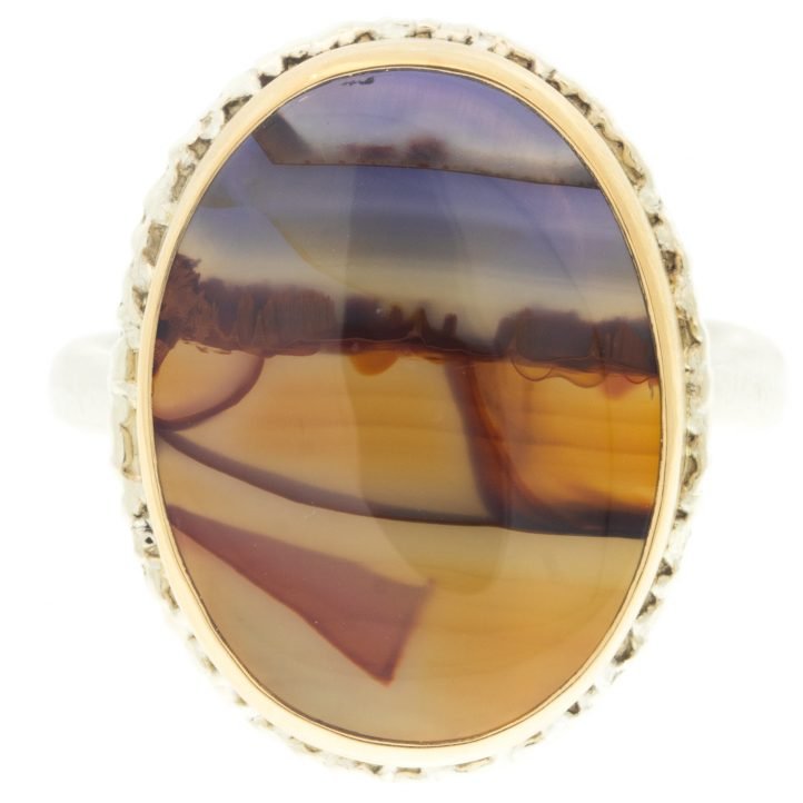 Jamie Joseph: Ring, Vertical oval, 14K yellow gold bezel set landscape agate on lava platform, Sterling silver Egyptian band, Stone measures 3/4 x 9/16, Currently available in size 7