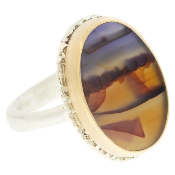 Jamie Joseph: Ring, Vertical oval, 14K yellow gold bezel set landscape agate on lava platform, Sterling silver Egyptian band, Stone measures 3/4 x 9/16, Currently available in size 7