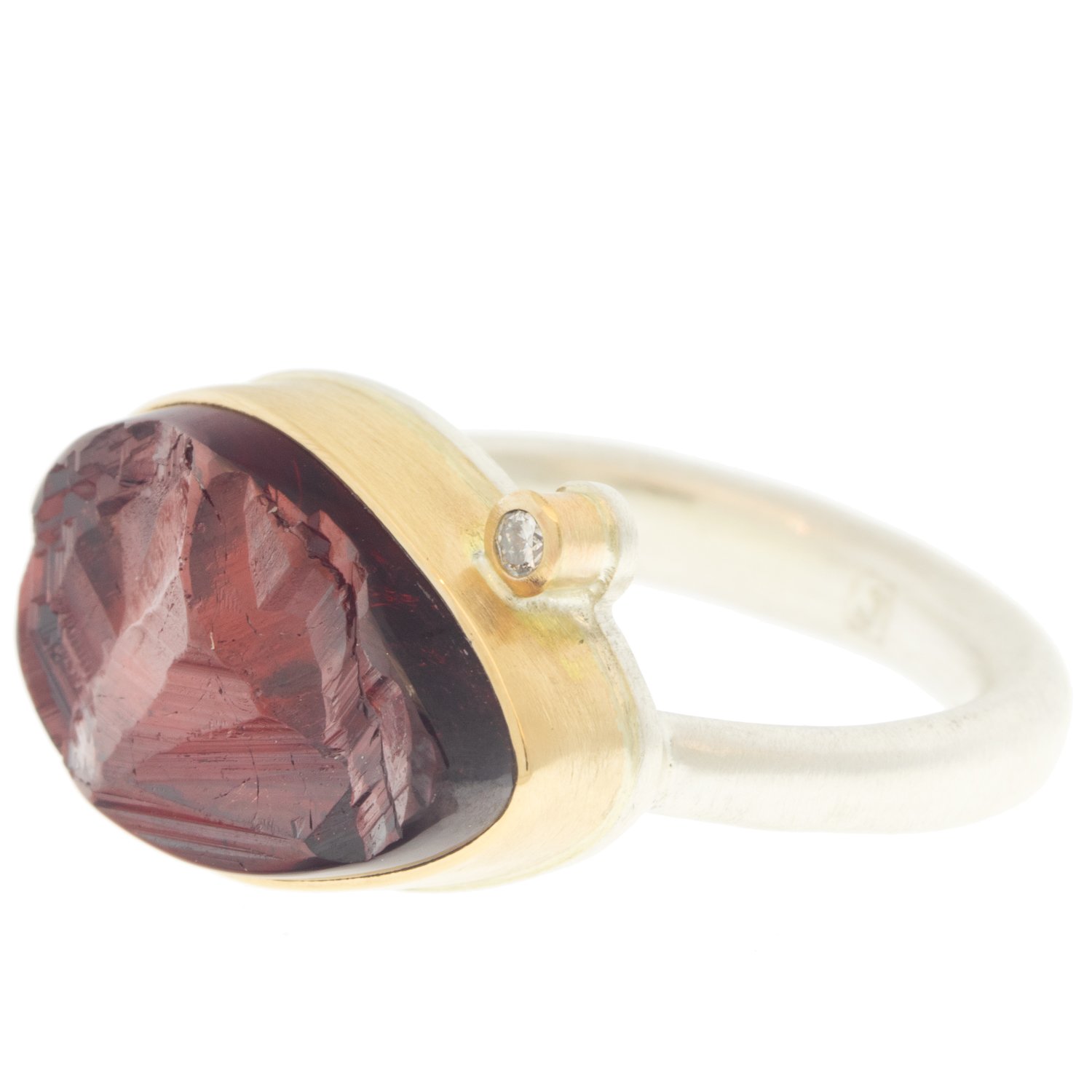 Jamie Joseph: Ring, Teardrop surface cut, 14K yellow gold bezel set garnet, Satellite diamond, .03ct, Sterling silver Egyptian band, Stone measures 7/16 x 11/16, Currently available in size 7 1/2