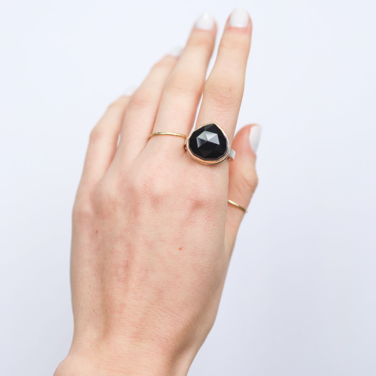 Jamie Joseph: Ring, Lotus rose cut, 14K gold bezel set black onyx, Sterling silver X band, Stone measures 5/8 x 5/8, Currently available in size 6 3/4