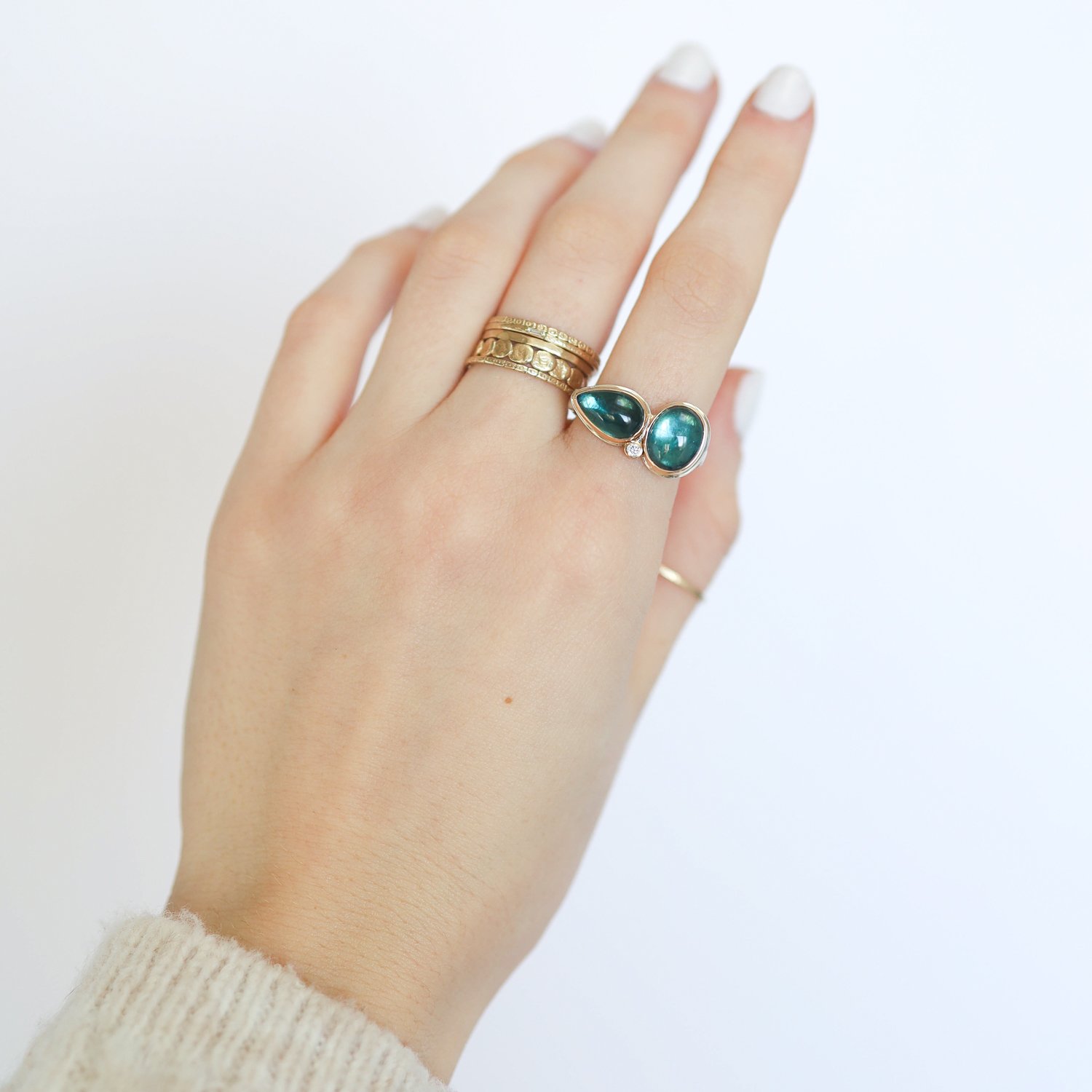 Jamie Joseph: Ring, Double oval and teardrop smooth, 14K gold bezel set indicolite tourmaline, Satellite diamond, .03ct, Sterling silver eroded live edge band, Stone measures 3/8 x 3/4, Currently available in size 7