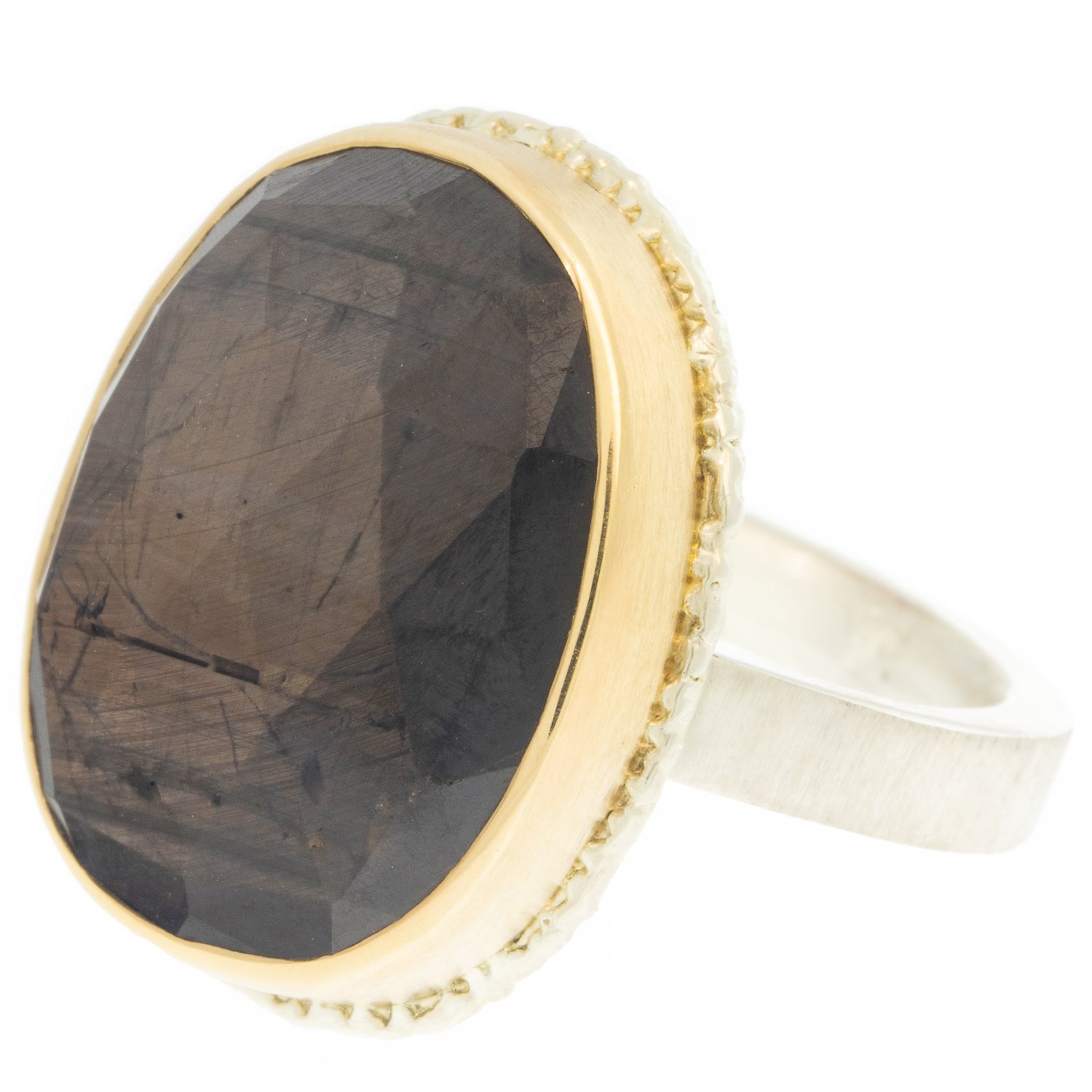 Jamie Joseph: Ring, Vertical oval rose cut, 14K gold bezel set brown sapphire on lava platform, Sterling silver X band, Stone measures 13/16 x 5/8, Currently available in size 7