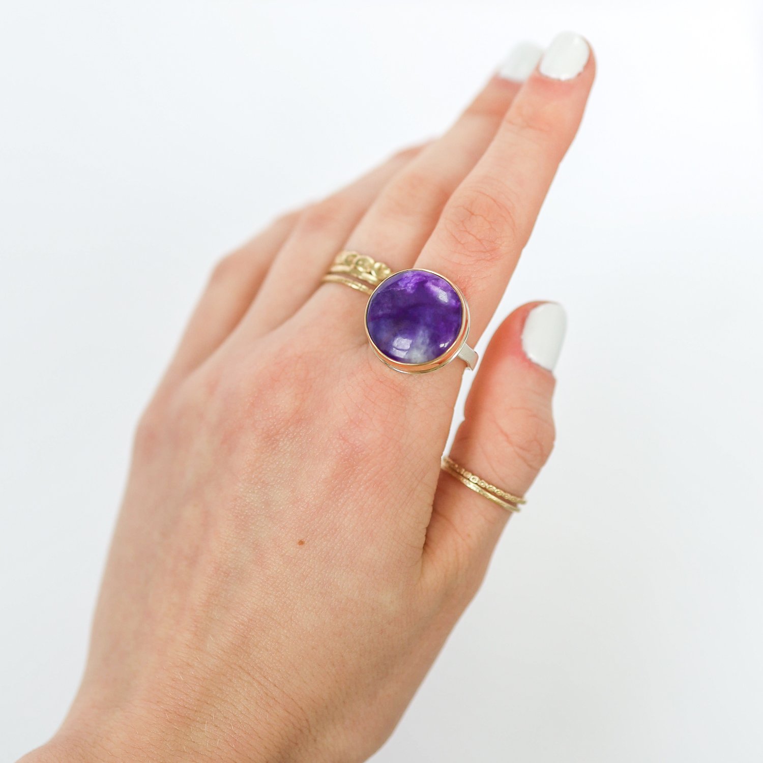 Jamie Joseph: Ring, Round, 14K gold bezel set Sugilite, Sterling silver eroded live edge band, Stone measures 11/16 in diameter, Currently available in size 7 3/4
