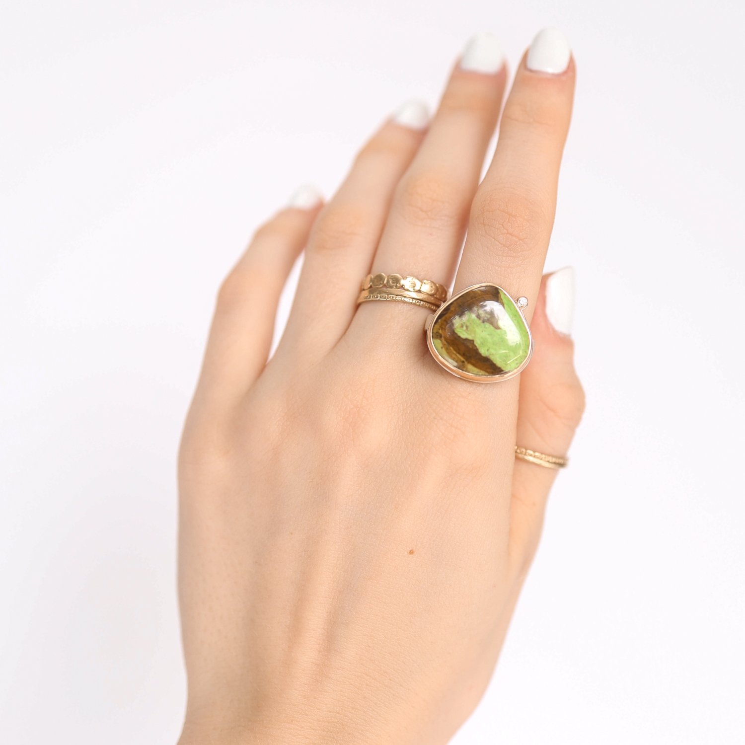 Jamie Joseph: Ring, Lotus, 14K gold bezel set Gaspeite, Satellite diamond .025ct, Sterling silver soft live edge band, Stone measures 11/16 x 3/4, Currently available in size 7