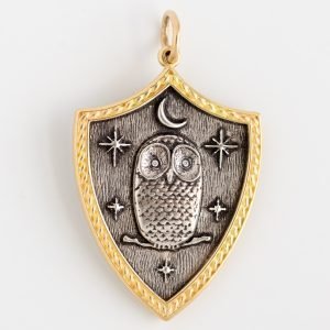 Erica Molinari Trunk Show: Charm, Large Shield Owl,Stars and Moon, "Two roads Diverged in a Wood and I took The One Less Travelled", Diamonds, .004 TCW, Sterling silver, 18K gold, Measures 1 9/16 x 15/16 including bail