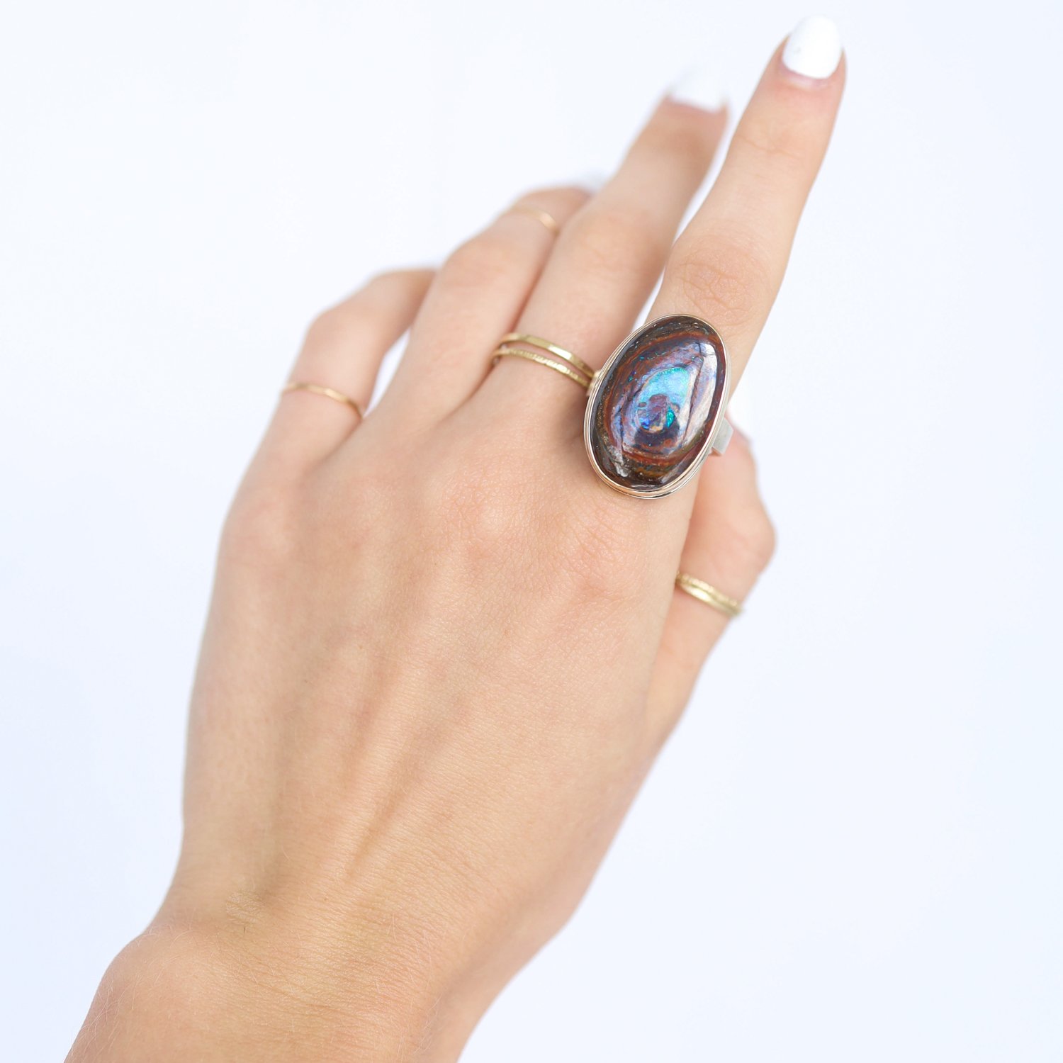Jamie Joseph: Ring, Vertical oval, 14K gold bezel set Koroit boulder opal, Sterling silver live edge band, Stone measures 1 1/16 x 11/16, Currently available in size 7 1/4