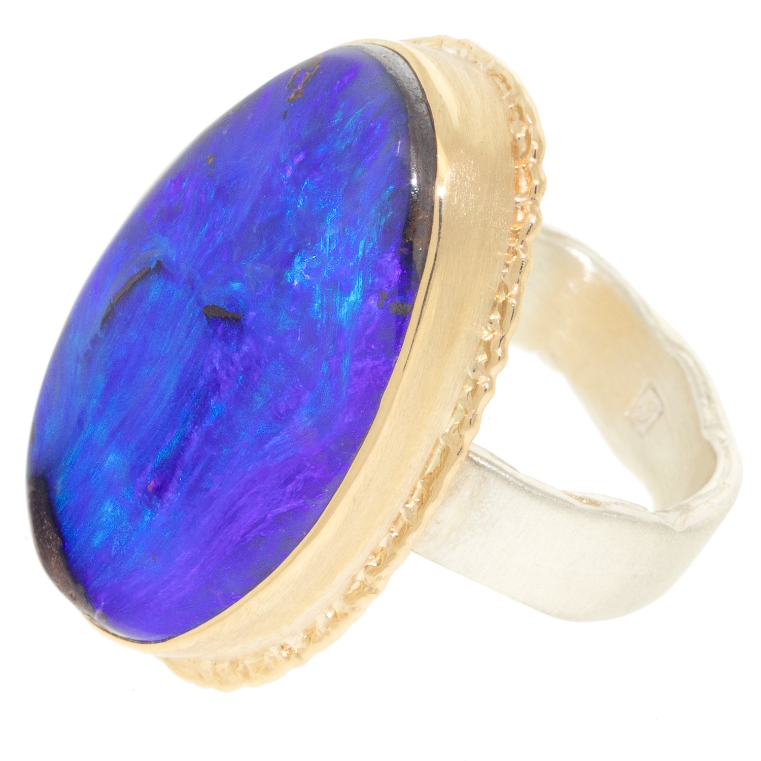 Jamie Joseph: Ring, Vertical asymmetrical, 14K gold bezel set Boulder opal on ruffled platform, Sterling silver wide eroded live edge band, Stone measures 1″ x 11/16″, Currently available in size 7 1/2