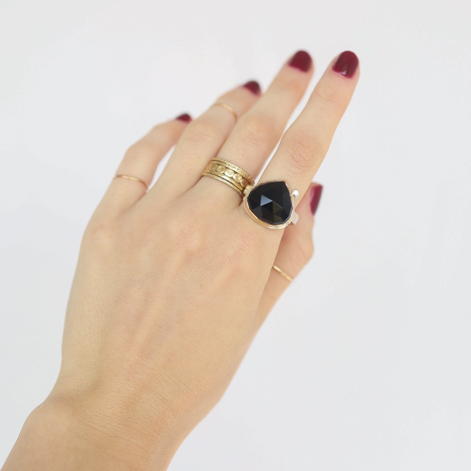 Jamie Joseph: Ring, Lotus rose cut, 14K gold bezel set black onyx, Satellite diamond, .03ct, Sterling silver soft live edge band, Stone measures 1 x 3/4, Currently available in size 7 1/4