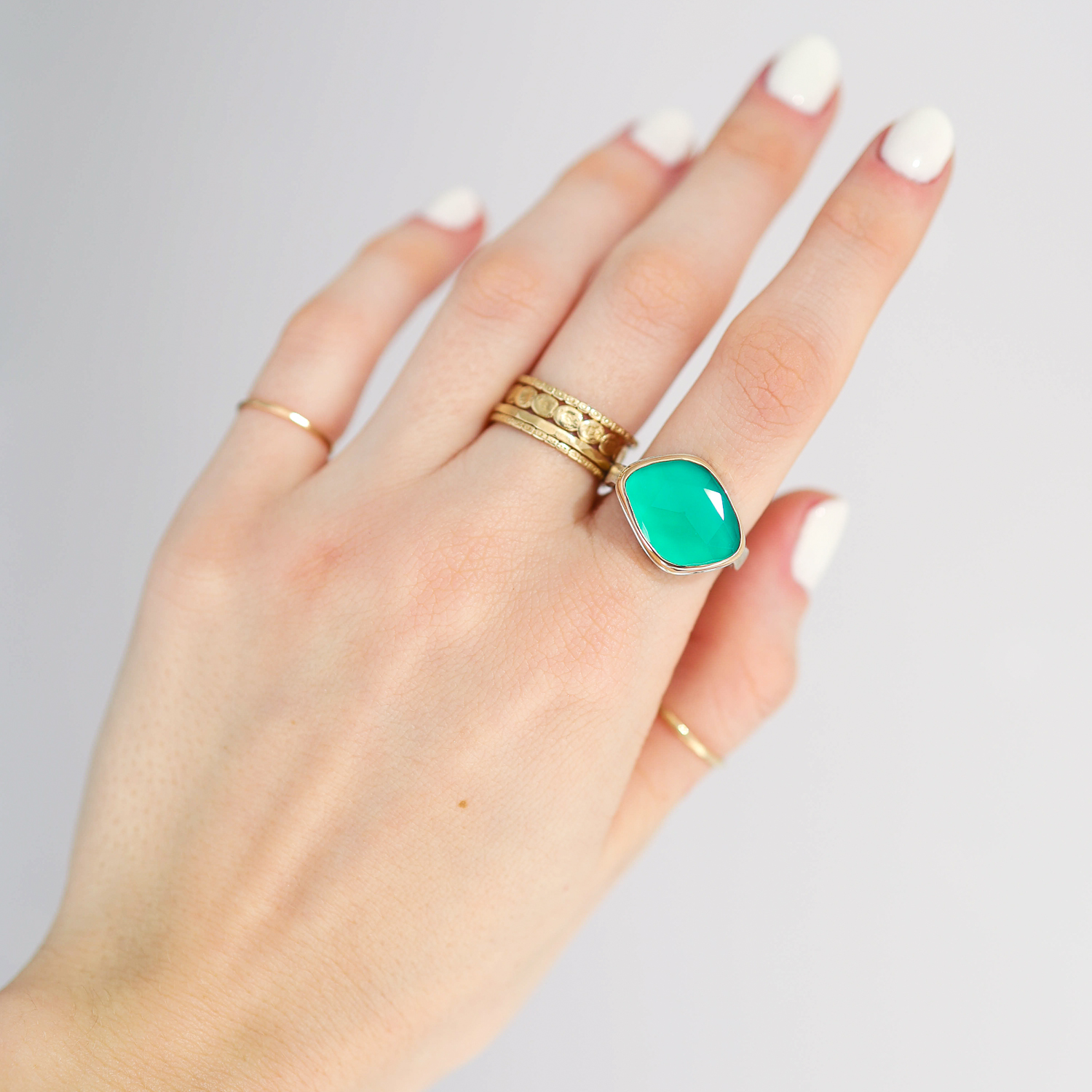 Jamie Joseph: Ring, Small asymmetrical rose cut, 14K gold bezel set green onyx, Sterling silver eroded live edge band, Stone measures 1/2 x 5/8, Currently available in size 6 1/4