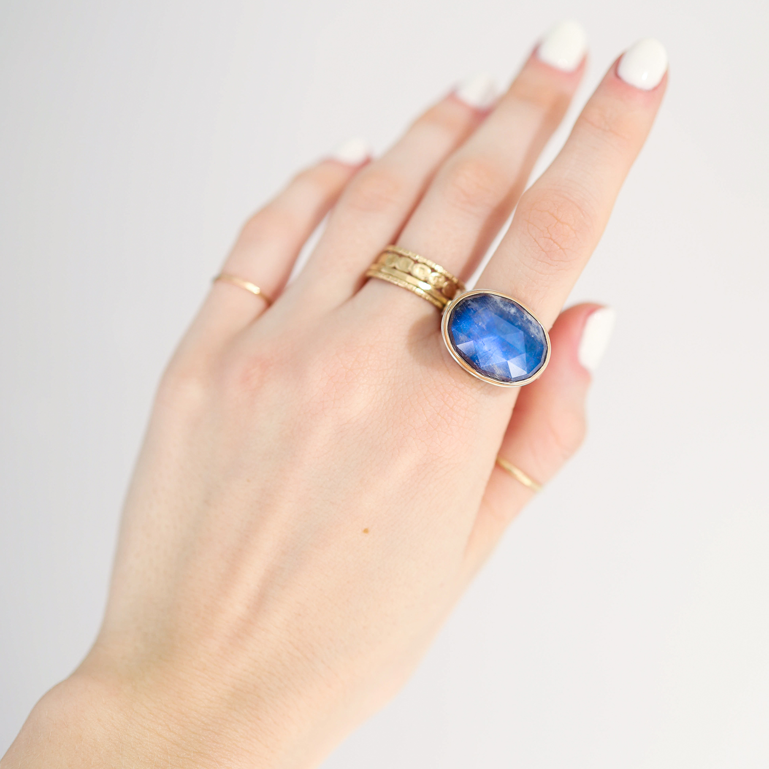 Jamie Joseph: Ring, Rose cut oval, 14K gold bezel set rainbow moonstone, Sterling silver X band, Stone measures 9/16 x 3/4, Currently available in size 7 1/2