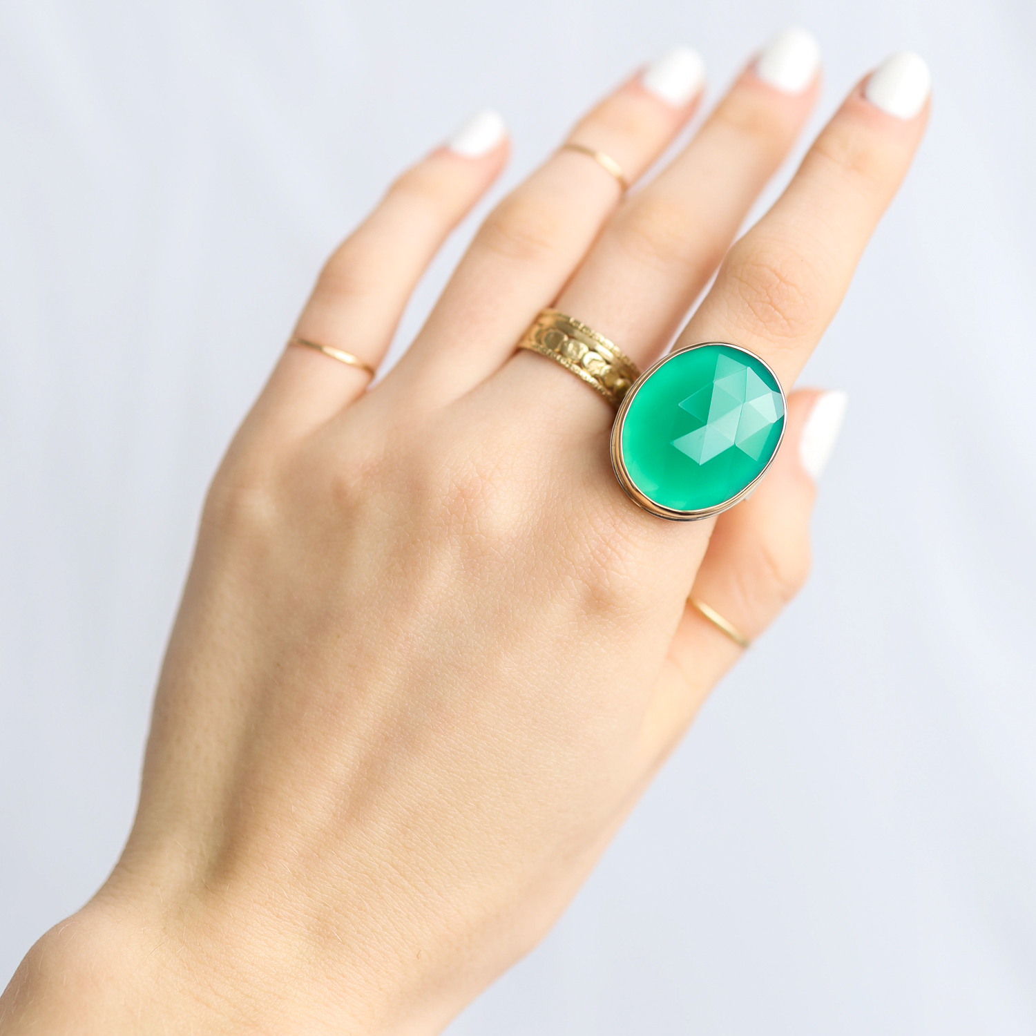 Jamie Joseph: Ring, Vertical oval rose cut, 14K gold bezel set green onyx, Sterling silver tapered X band, Stone measures 15/16 x 3/4, Currently available in size 7 1/4