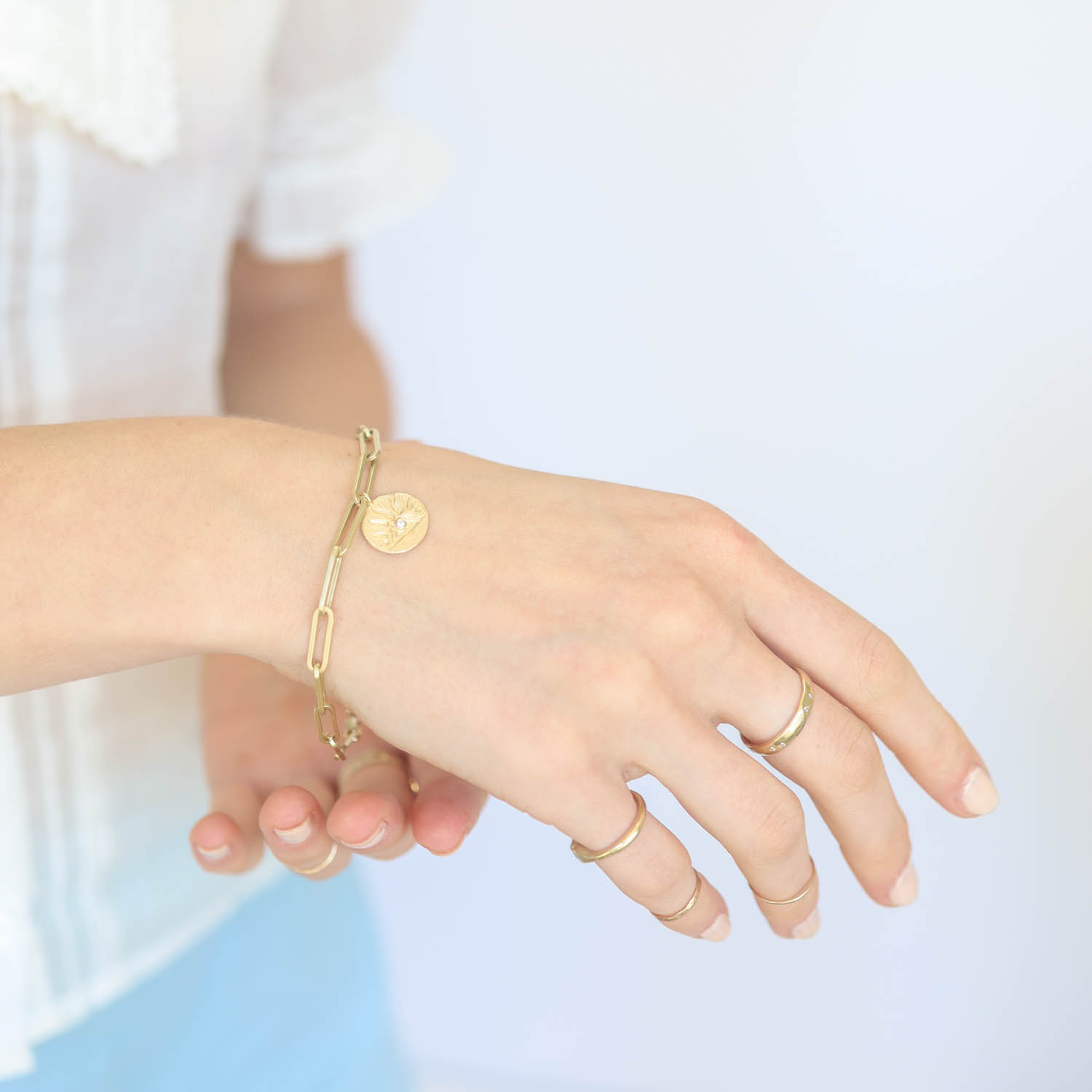 Victoria Cunningham Trunk Show: 14K heavy paperclip bracelet w/sunrise charm 1/2" in diameter 7 1/2" in length