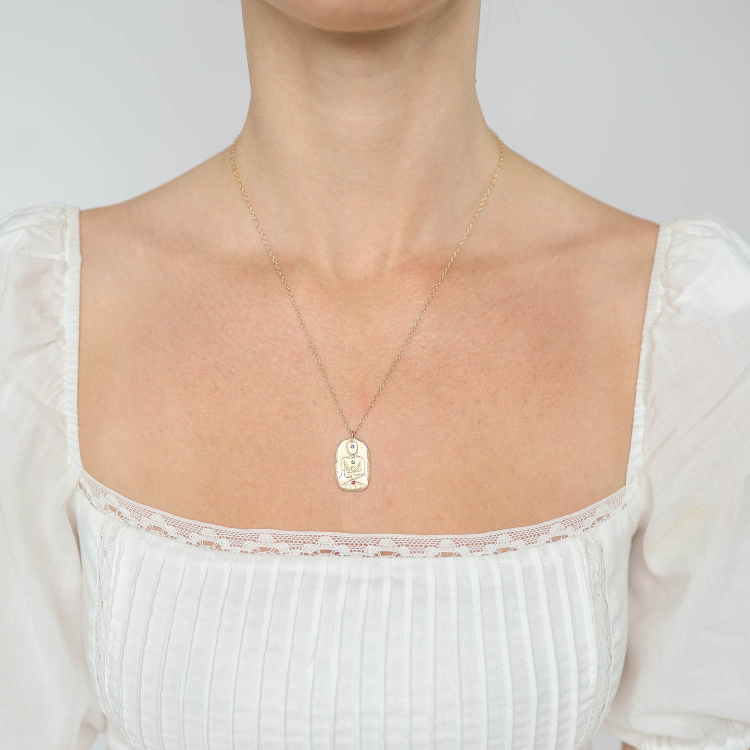 Victoria Cunningham Trunk Show: 14K chakra buddha shrine w/ multi colored sapphires 1" x 9/16" inc bail 19" in length