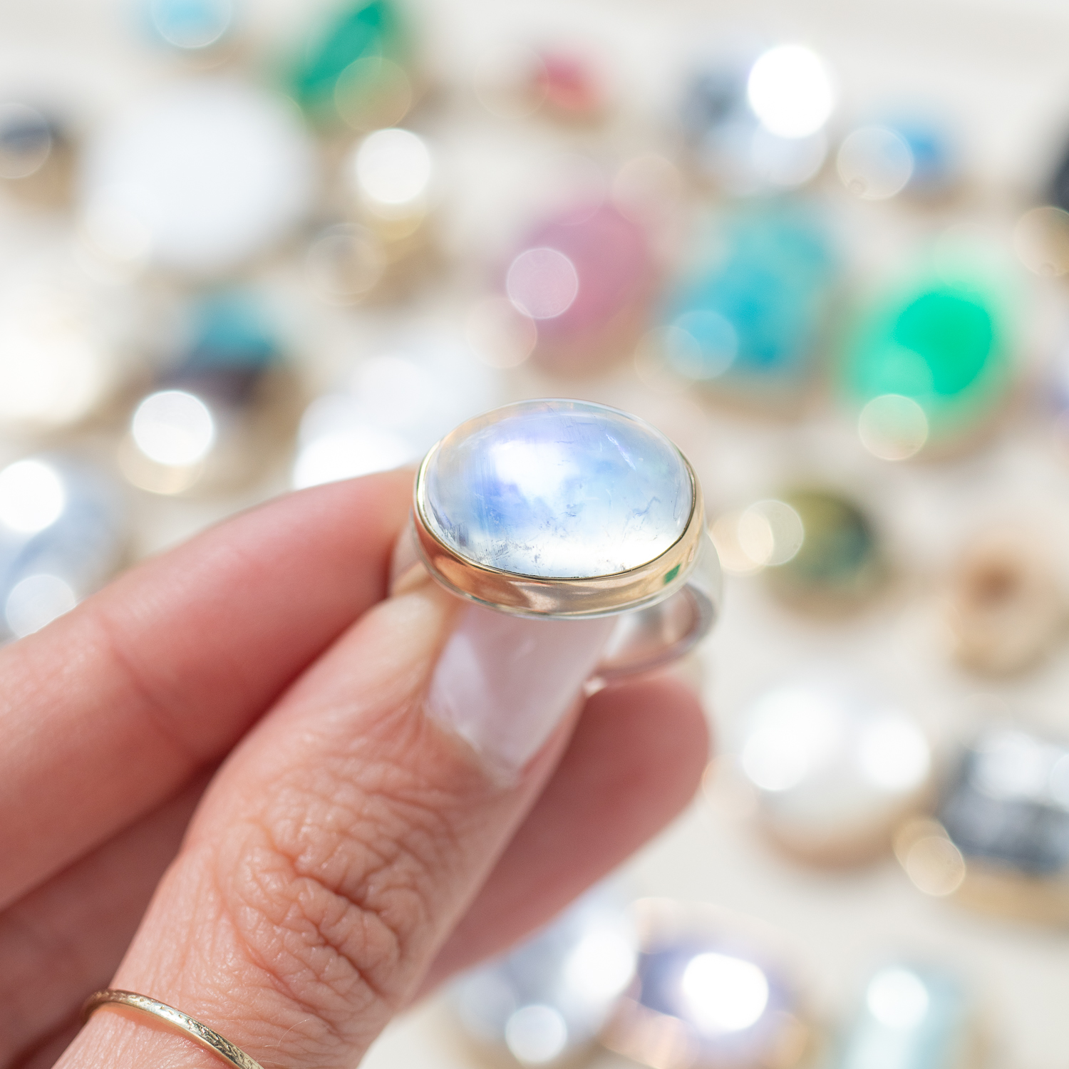 Jamie Joseph: WHITE RAINBOW MOONSTONE SS & 14k gold w/ oval smooth on Y band size 7, 7/16" x 11/16"