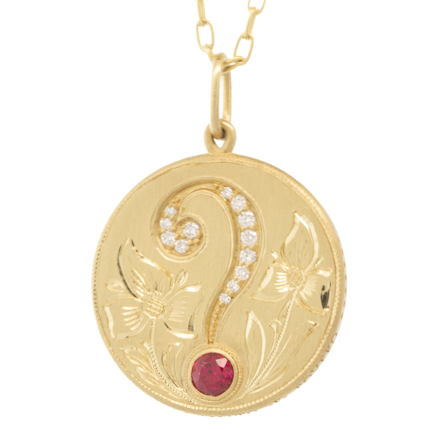 Erica Molinari Trunk Show: 18K Hand engraved Question Mark set with 1 ct Rd Ruby and .165cts white diamonds, 1 5/16" x 15/16" including bail