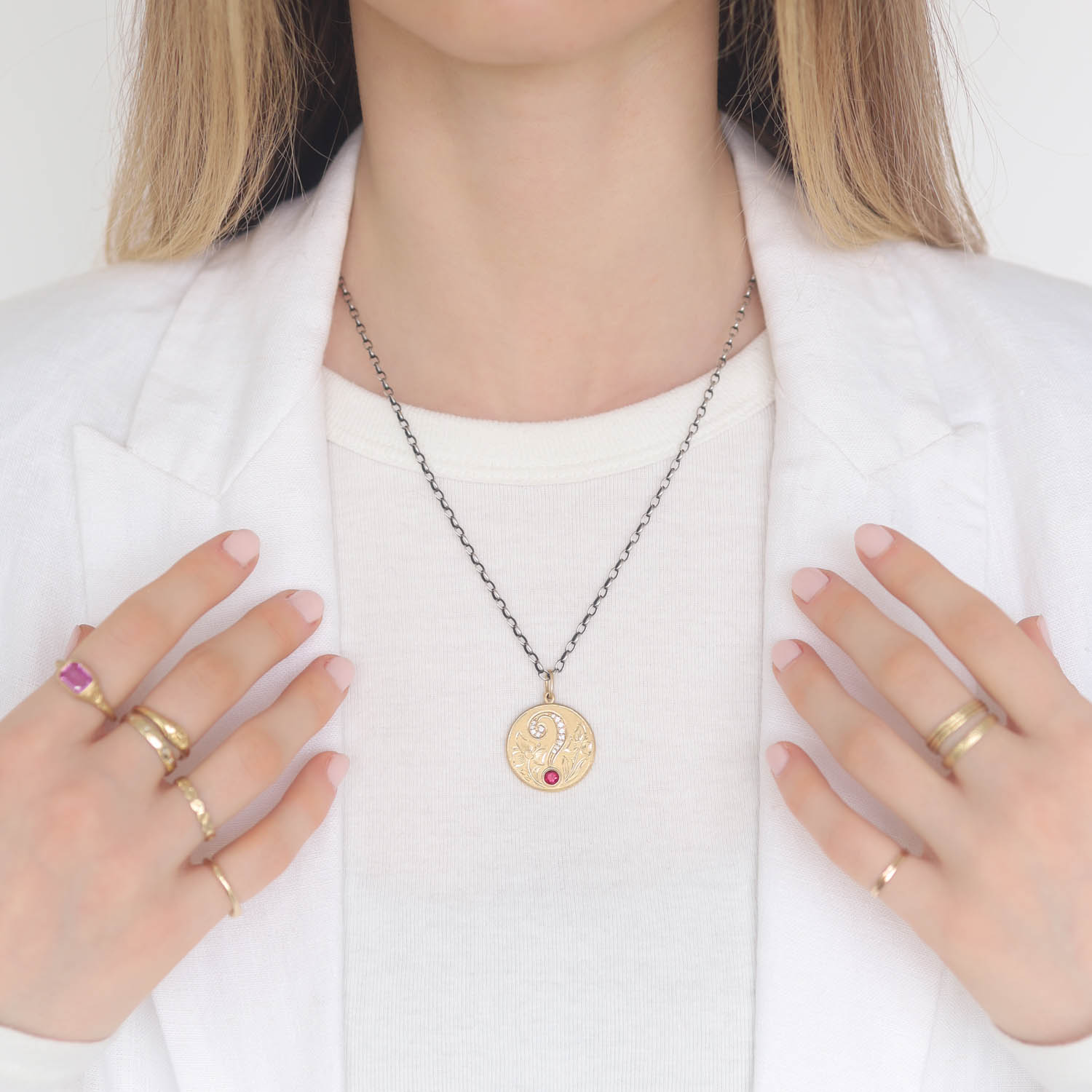 Erica Molinari Trunk Show: 18K Hand engraved Question Mark set with 1 ct Rd Ruby and .165cts white diamonds, 1 5/16" x 15/16" including bail