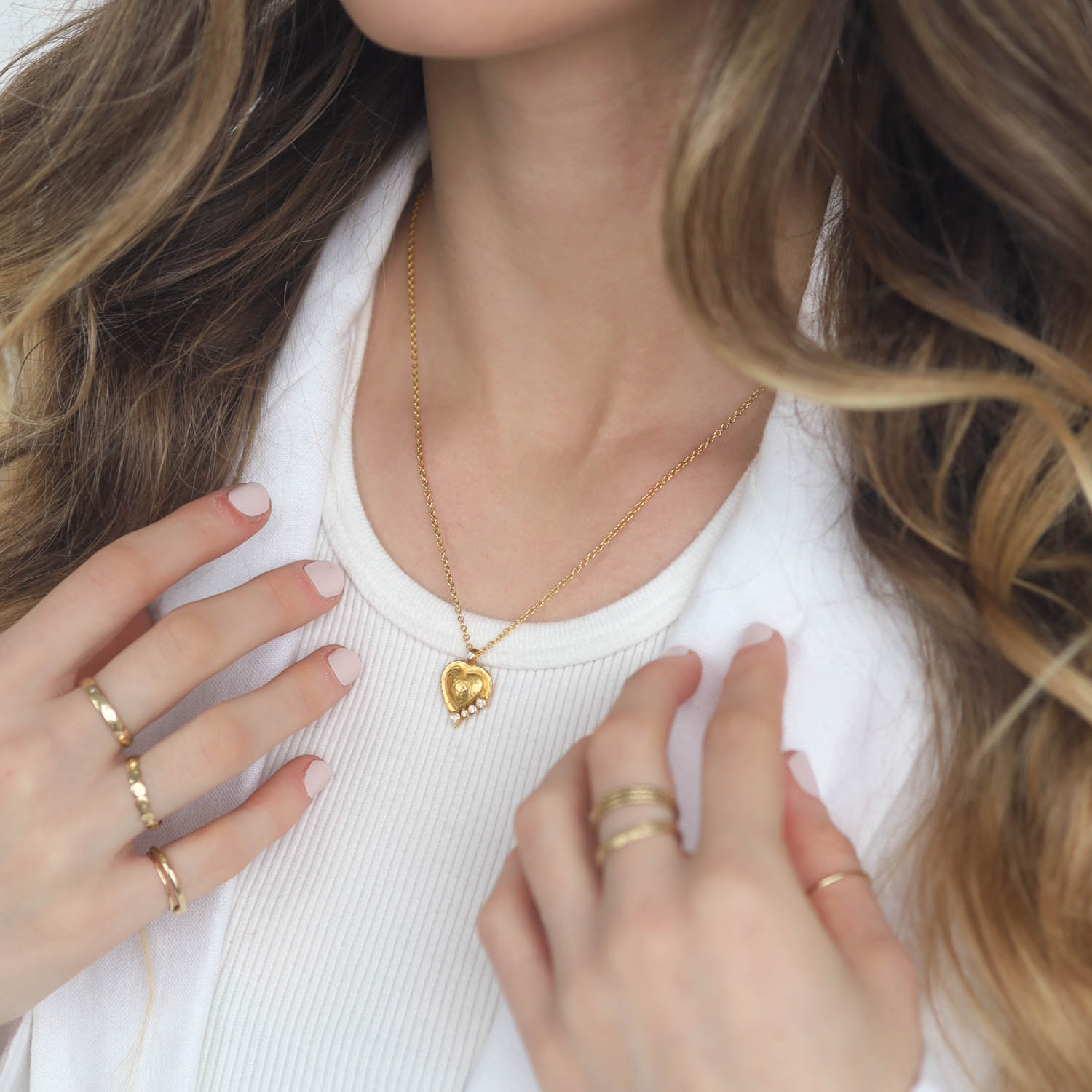 Gurhan: Necklace, one of a kind, pendant, 24K gold featuring 9mm heart shaped amulet with hammered dome center mised shaped brilliant cut white diamonds. TCW .119, 22K gold slider bale with brilliant cute white diamond, CTW .018 16-18" 22K gold solid