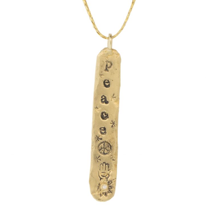Victoria Cunningham Trunk Show: 14k peace (charm only), Measures 1 9/16" x 1/4" including bail