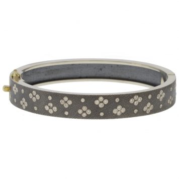 Rene Escobar: SHAYNA 8MM. SS hinged bangle featuring an 18k YG push button style clasp set with 0.65CT of WH diamonds.