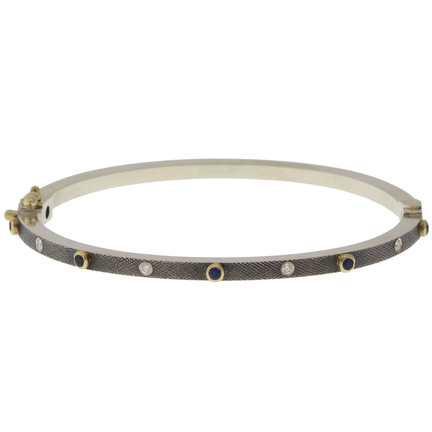 Rene Escobar Trunk Show:25 0.30CT 2.5MM. SS hinged bangle featuring an 18k YG push button style clasp and 5 18k YG bezels set with 0.30CT of SA.