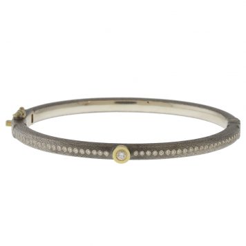 Rene Escobar:GYPSY BANGLE 4MM. SS hinged bangle featuring an 18k YG push button style clasp and 18k YG bezel with RND cut 0.40ct of WH diamonds.