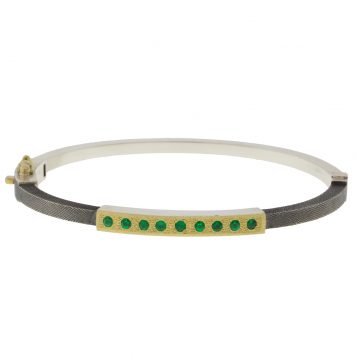 Rene Escobar: 2.5MM. SS hinged bangle featuring an 18k YG push button style clasp set with 0.35CT weight of EME diamonds.