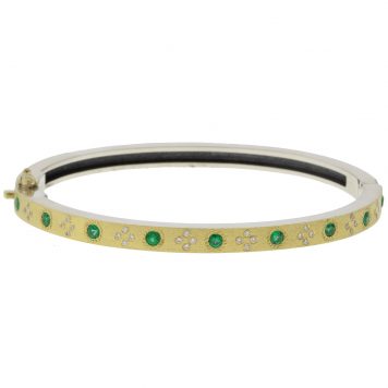 Rene Escobar: 4MM. SS hinged bangle featuring an 18k YG push button style clasp and a solid 18k YG top sheet set with 0.85CT of EME and WH diamonds