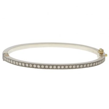 Rene Escobar:ADAM BANGLE,SS 2.5MM. SS hinged bangle featuring an 18k YG push button style clasp and set with 0.70CT of WH diamonds.