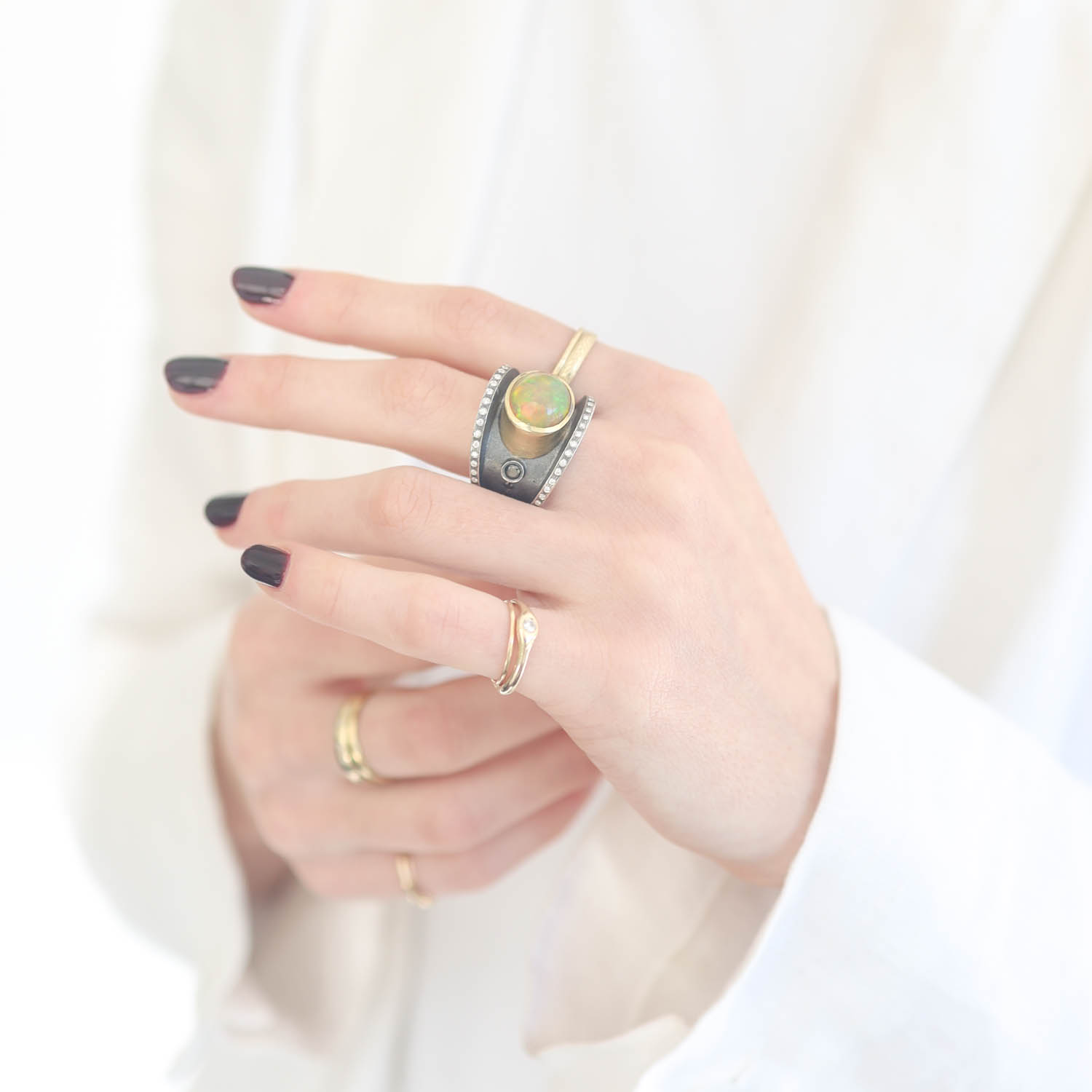 Rene Escobar Trunk Show:SS ring and 18k YG bezel set with 4.08CT in opal and 0.60CT in WH diamonds.