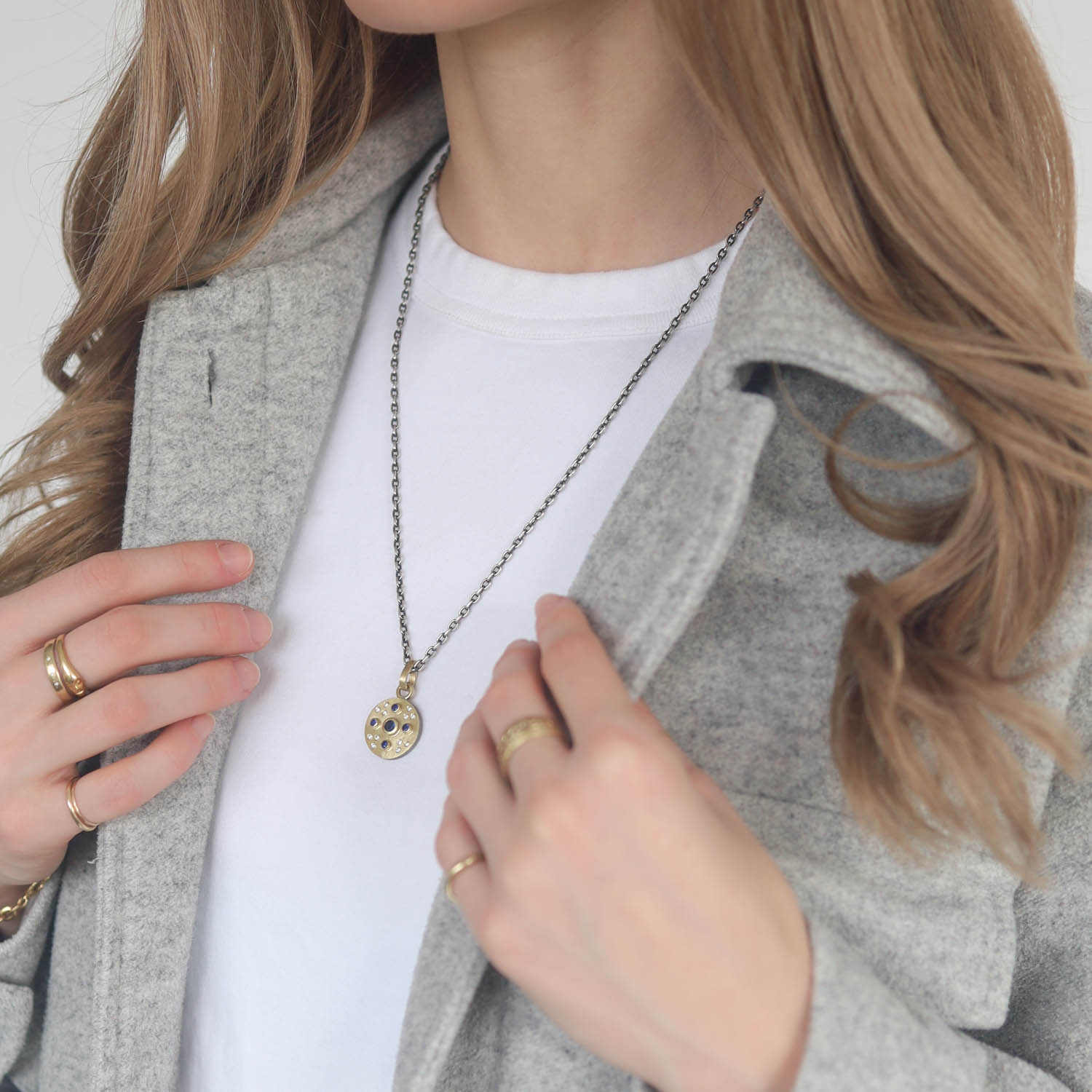 Rene Escobar Trunk Show:SS pendant with 18k YG top sheet and bezels set with 0.75CT in SA and WH diamonds and 18k YG bail.