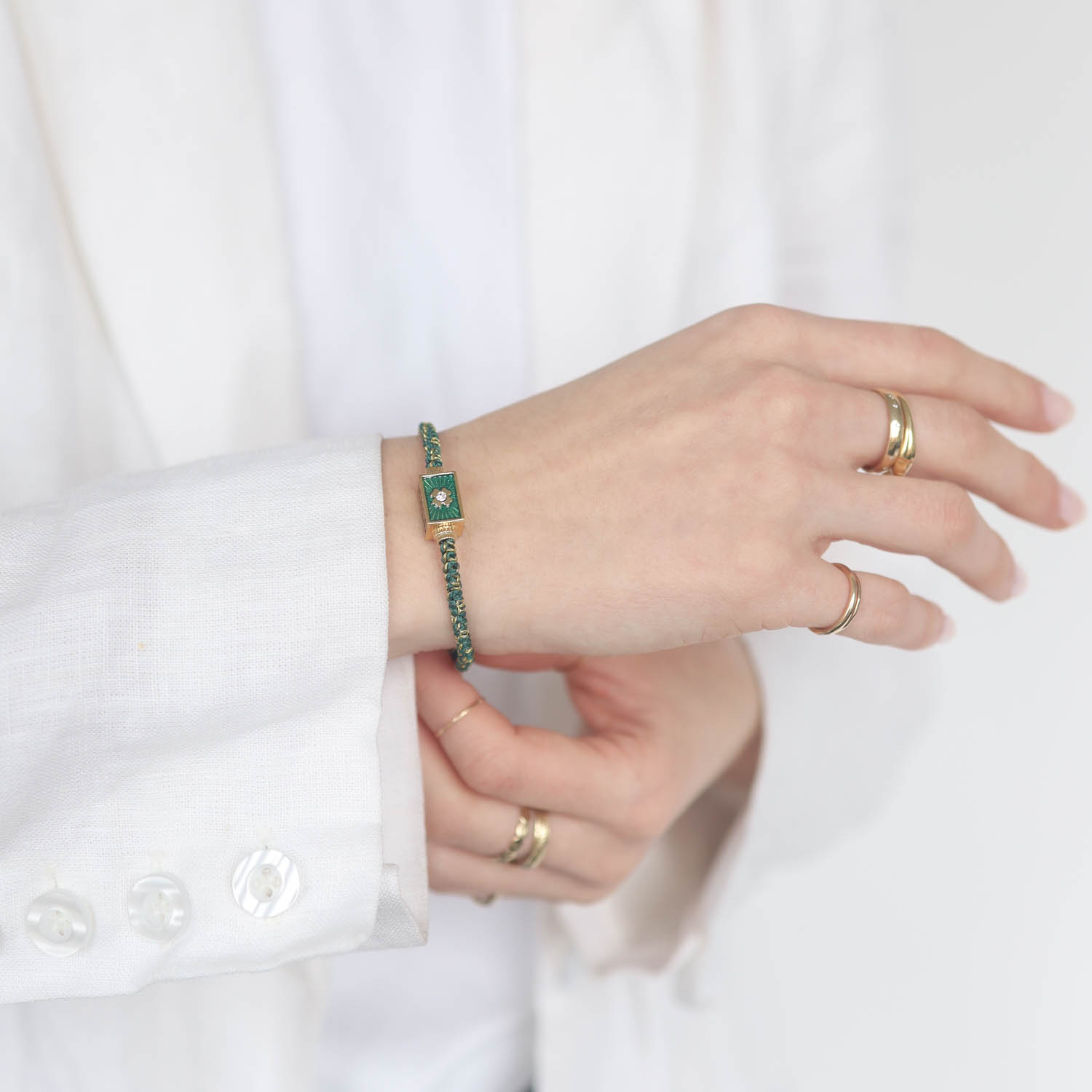 Tai: Bracelet, Deep Green Macrame Cord w/ Horseshoe Enamel Spinner- Lobster Closure 6"-8"