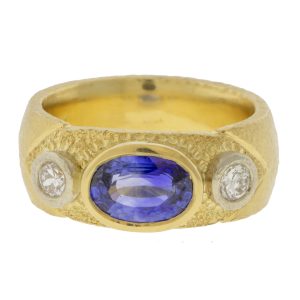 Alison Shiboski:18k Yellow gold ring with 1.75cts blue sapphire,2 diamonds 0.24ct in 14k white bezels