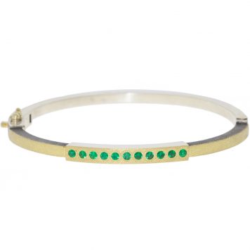 Rene Escobar: DIANA LUX 2.5MM. SS hinged bangle featuring an 18k YG push button style clasp and 18k YG top sheet set with 0.40CT Emeralds